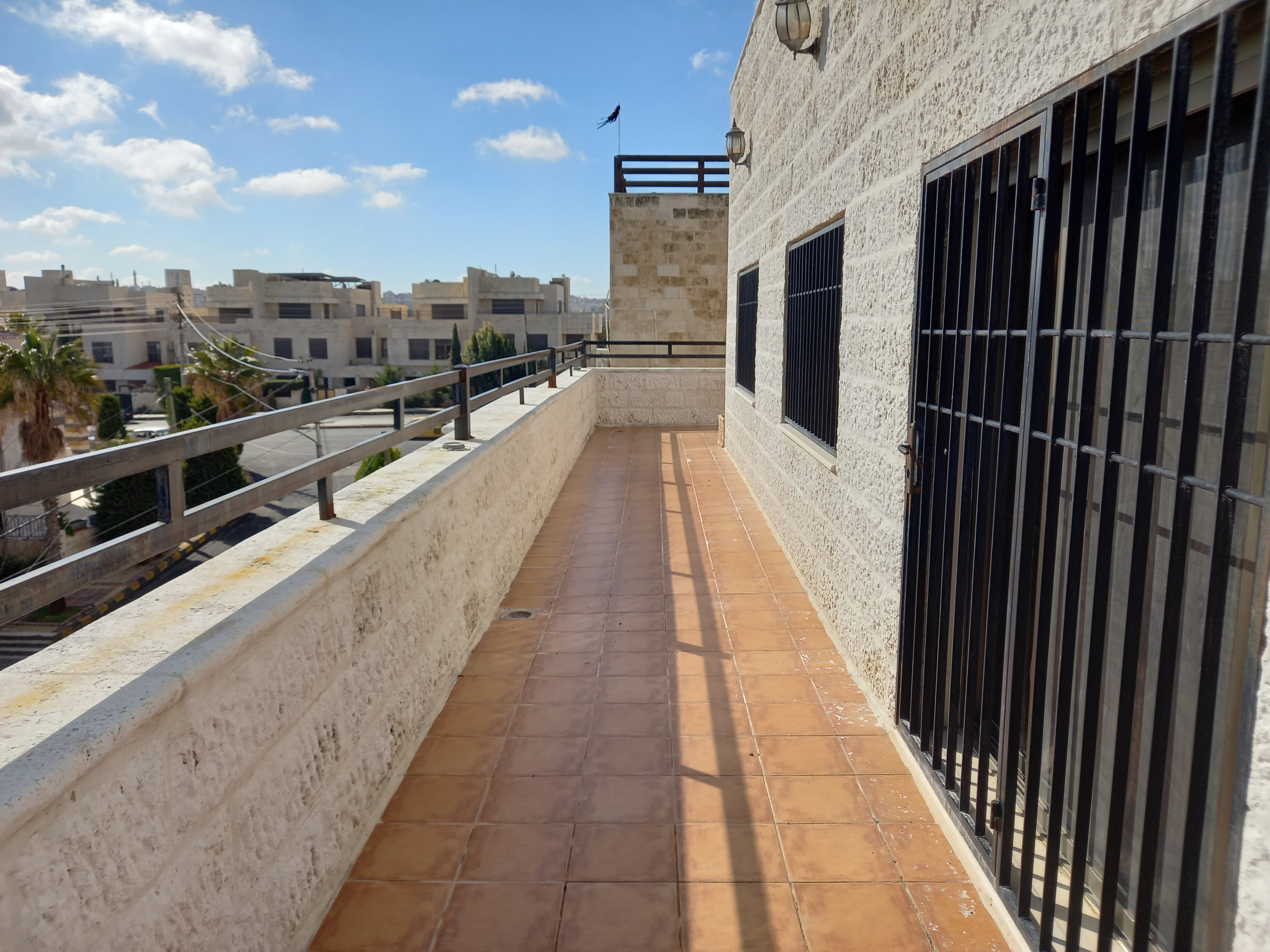 A fourth-floor apartment with a roof, available for rent or sale in Abdoun. - Property Image 13